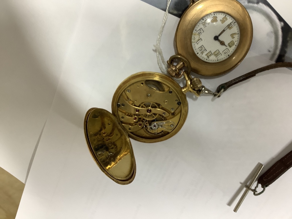 A continental 18ct gold open face keyless pocket watch, (a.f.) and a gold plated pocket watch.